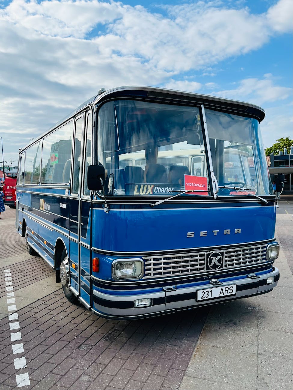 An old style coach or bus from the 50s or 60s