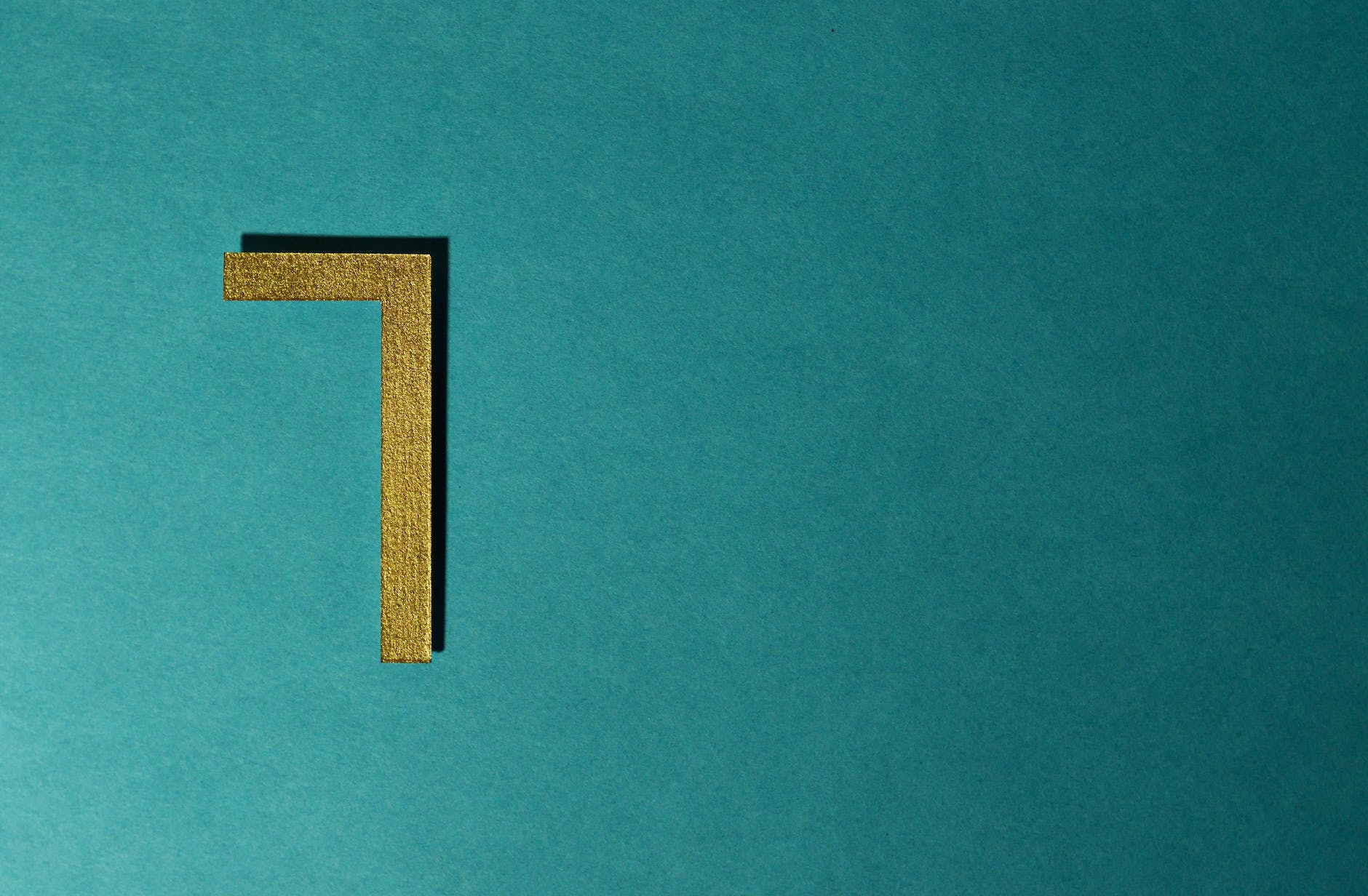 A gold number 7 against a blue background