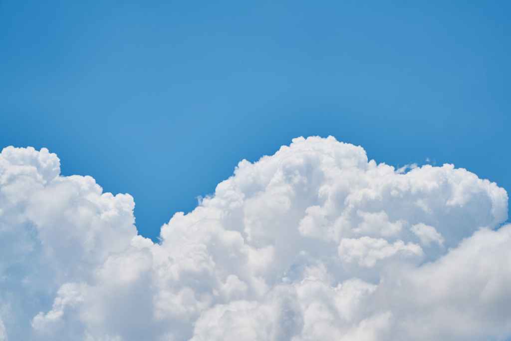 White fluffy clouds against a blue sky