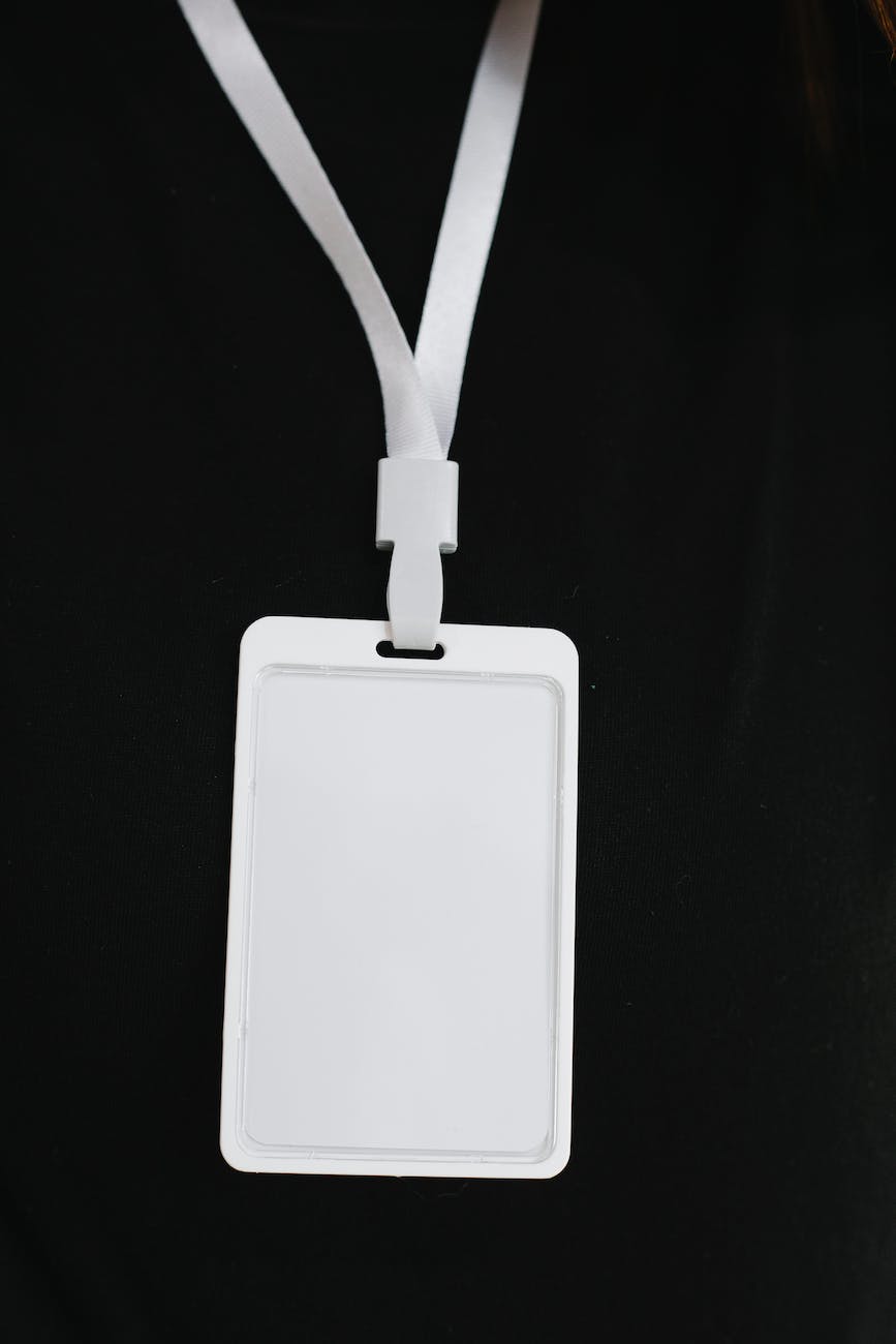 Blank white lanyard against a black background
