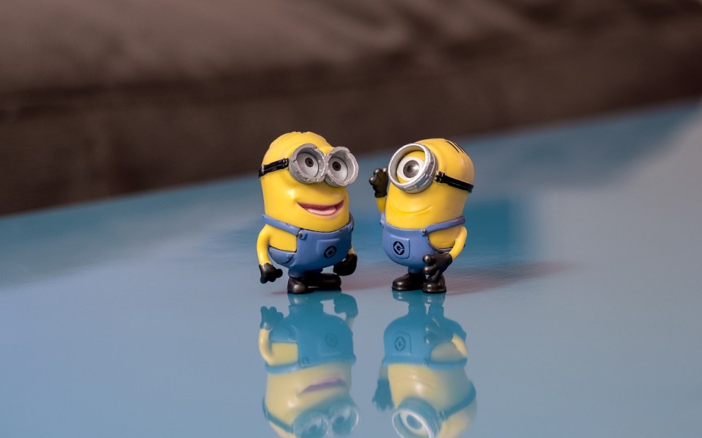 Two small figures resembling Minions from the "Despicable Me" series