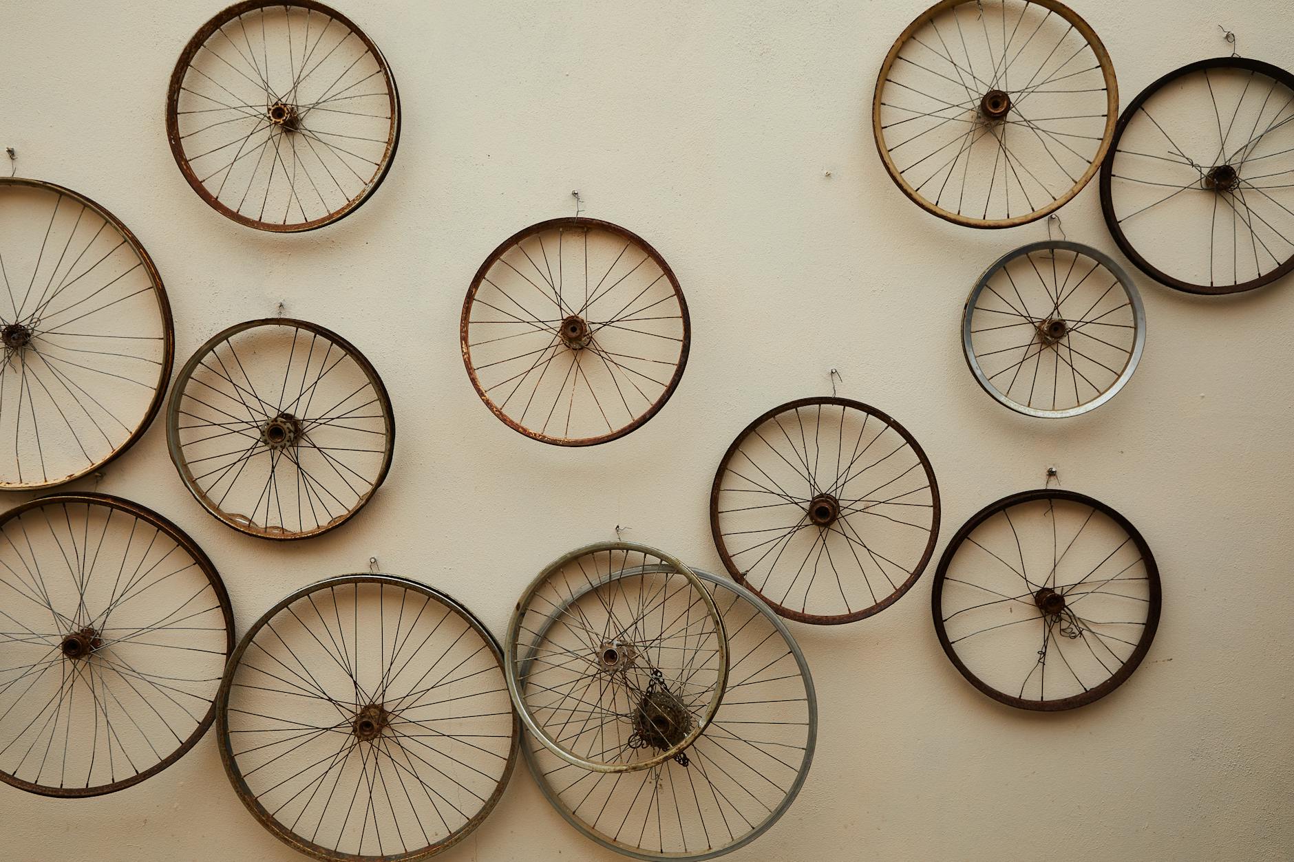 Old bicycle wheels hanging decoratively on a wall