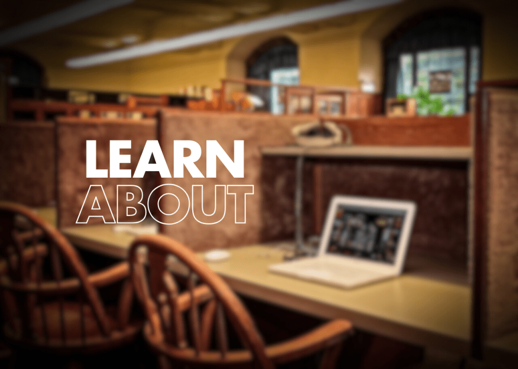 The text 'LEARN ABOUT' superimposed on a blurred image of a library with tables, chairs, and a laptop.