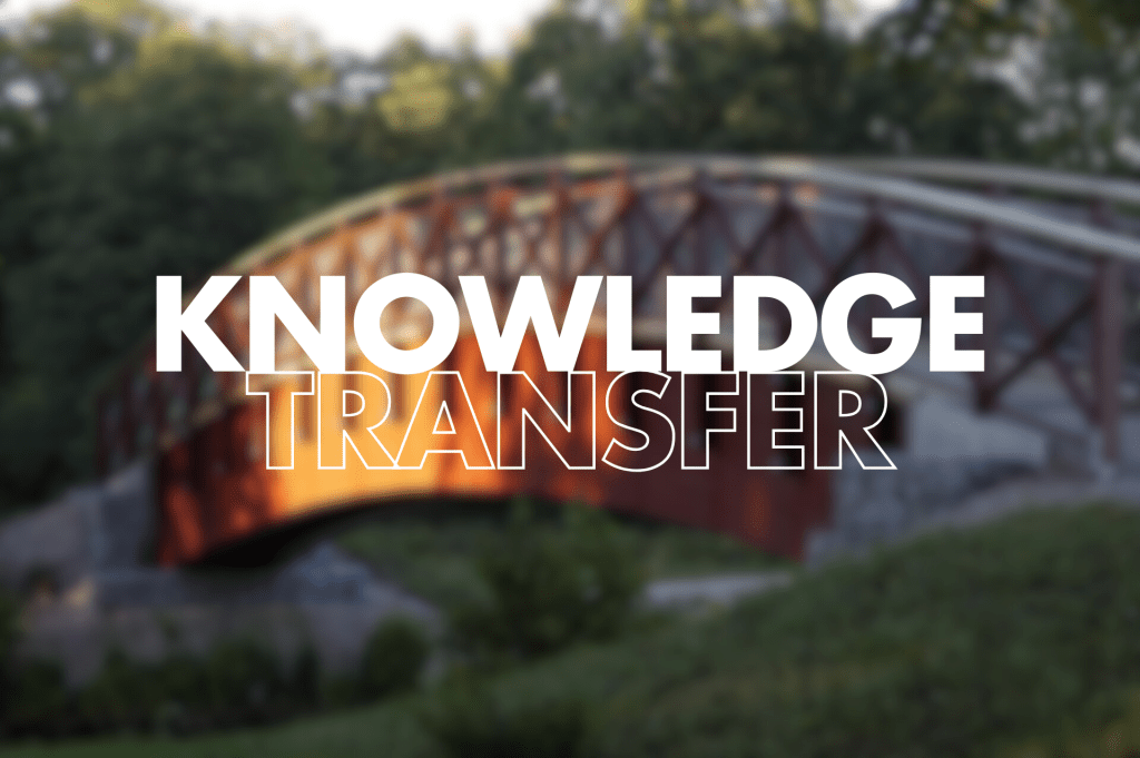 "Knowledge Transfer" in white text on a blurred background of a bridge.