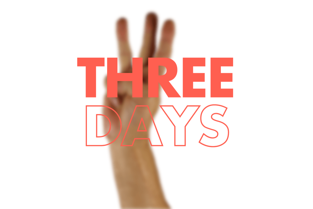 Blurred hand holding up three fingers against white background with orange text overlay reading "THREE DAYS"