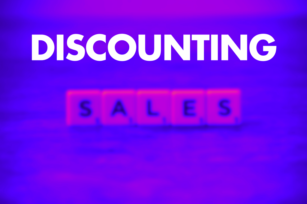 vibrant, blurred background featuring the word "DISCOUNTING" in large, bold text above the word "SALES" spelled out with letter tiles. The overall colour scheme has a purple hue.