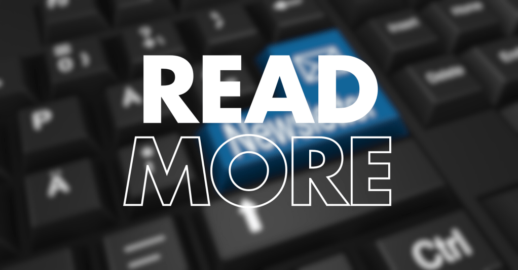 A close-up of a computer keyboard with the words "READ MORE" prominently displayed in bold, stylised text over a blue key.