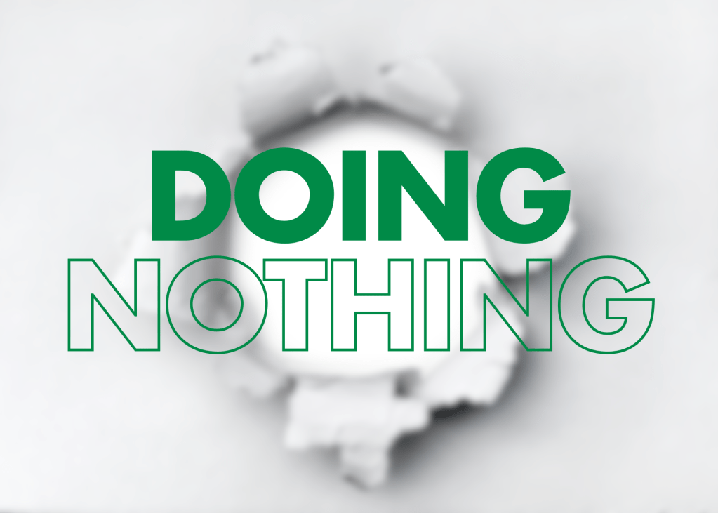 A blurred image of a torn piece of paper revealing a blank space, featuring the words "DOING NOTHING" prominently displayed in large, bold green text.