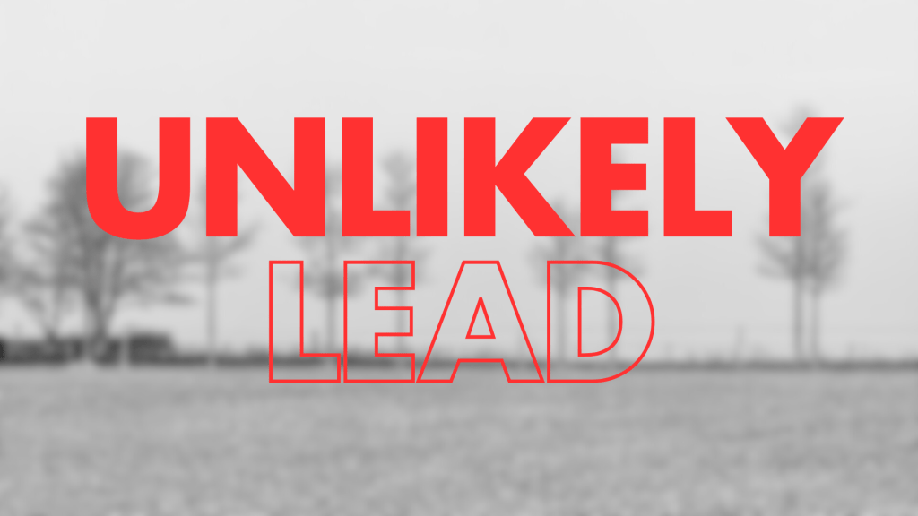 A blurred black-and-white image of a frozen winter landscape with trees, featuring the words "UNLIKELY LEAD" prominently displayed in large, bold red text.