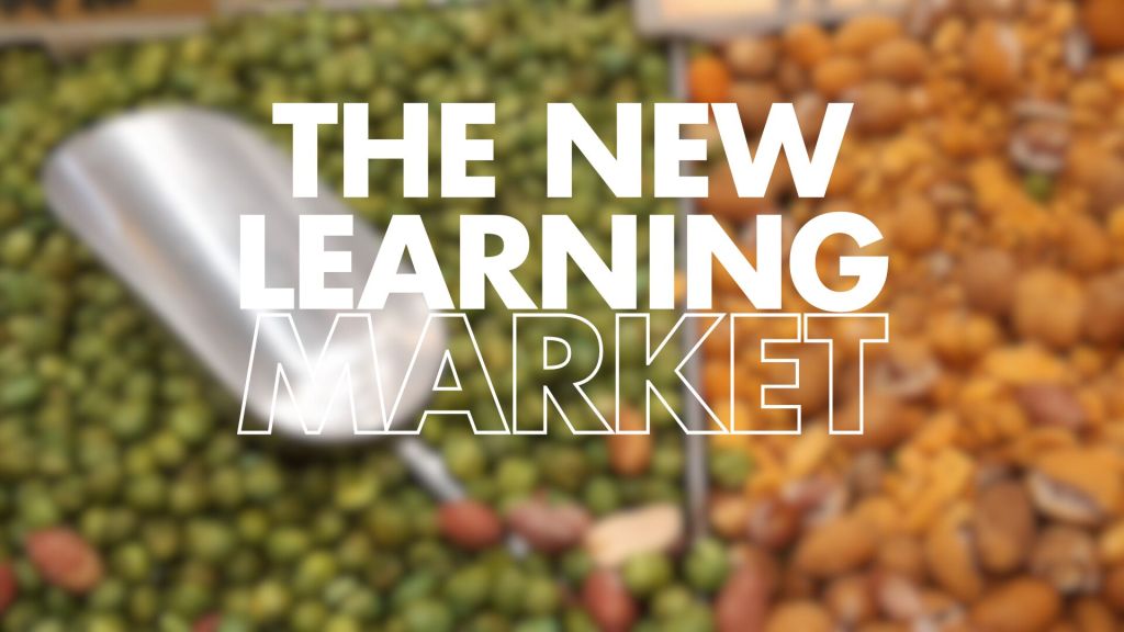 A blurred image of a market display with various fruits and nuts, featuring the words "THE NEW LEARNING MARKET" prominently displayed in large, bold white text.