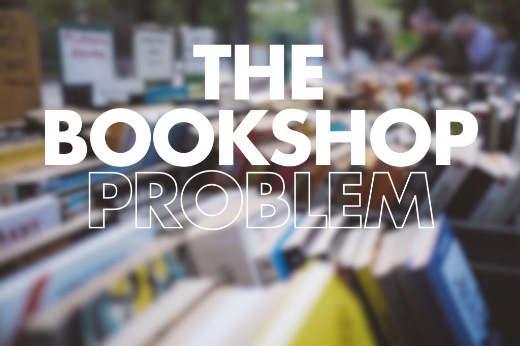 The image shows a blurred background of books in a bookshop, with various titles and cover designs visible. In the foreground, the phrase "THE BOOKSHOP PROBLEM" is prominently displayed in large, bold, white letters. The contrast between the text and the slightly out-of-focus books creates a sense of intrigue, emphasising the theme of a bookshop.