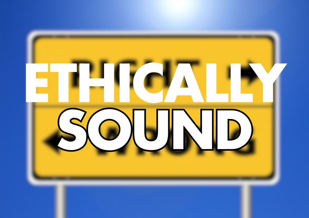 A yellow sign with the words "ETHICALLY SOUND" overlaid in bold black and white text, with a blurred background.


