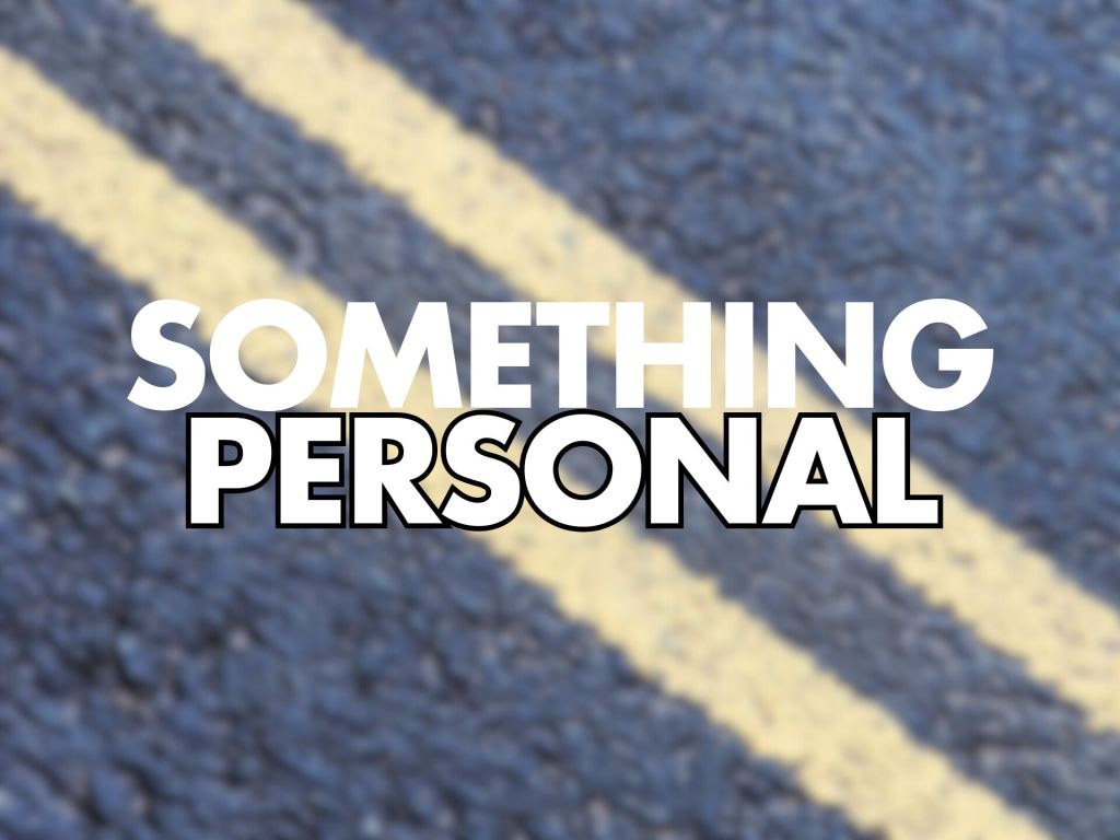 Large bold white text "SOMETHING" above outlined black-and-white bold text "PERSONAL" centred over a blurred close-up of blue asphalt with two pale yellow diagonal lane lines.