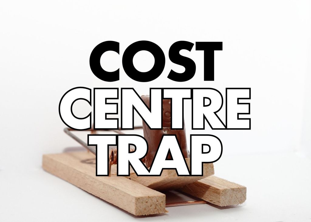Blurry white background and a wooden old time mousetrap; large black text reads “COST” on top, “CENTRE” in the middle, and “TRAP” outlined in white/black at the bottom.