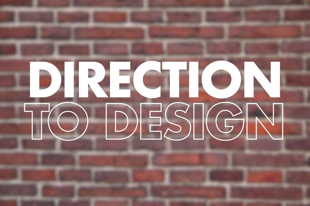 A brick wall background with big white-filled text "DIRECTION" and white-outlined text "TO DESIGN" centered across the image.